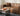 Close-up of a brown M1 Faux Leather Sofa showing seat cushions, matching pillows, and piped edges.